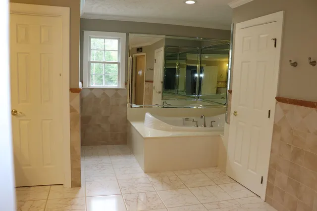 a bathroom with a bathtub and a sink