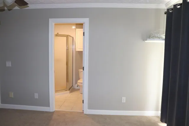 a view of a bathroom with a tub and shower