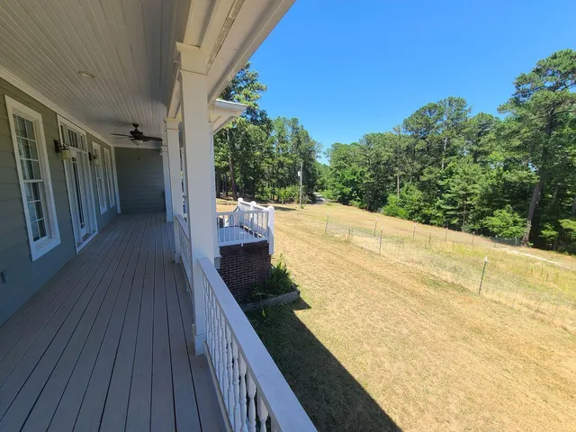 a balcony with wooden floor