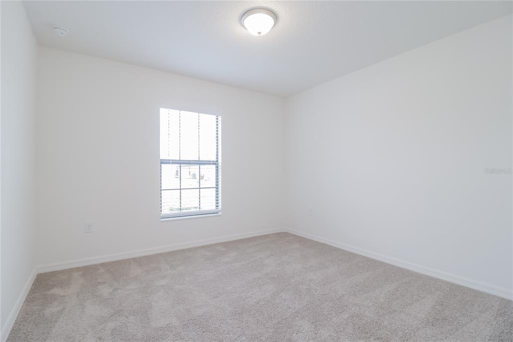 1187 Moyle Way Mascotte, FL 34753 - Photo 12 of 16 an empty room with a window