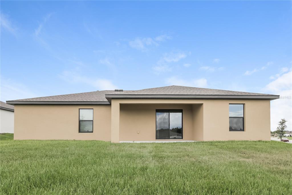 1187 Moyle Way Mascotte, FL 34753 - Photo 15 of 16 a house view with a backyard space