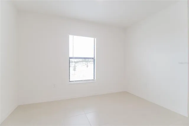 a kitchen with granite countertop stainless steel appliances a sink stove and microwave