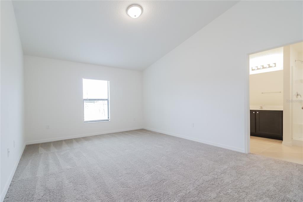 1187 Moyle Way Mascotte, FL 34753 - Photo 7 of 16 an empty room with windows