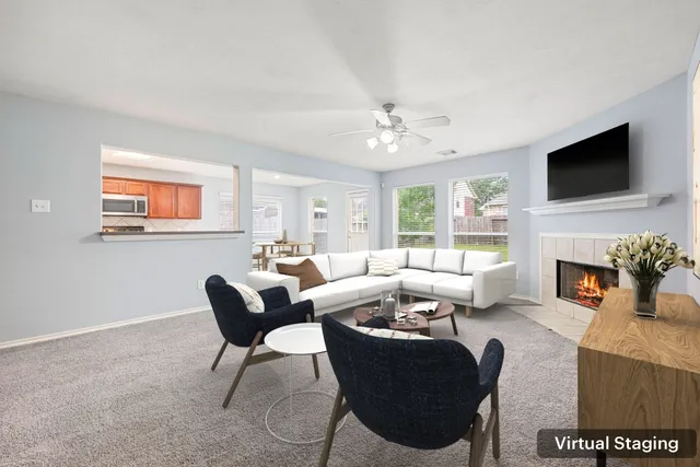 an empty room with windows and cabinet