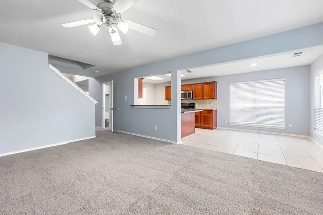 a view of a kitchen with a sink and a fireplace