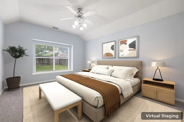 a view of an empty room with a ceiling fan