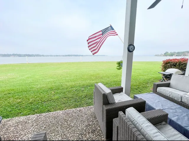 a view of a patio with a table and chairs