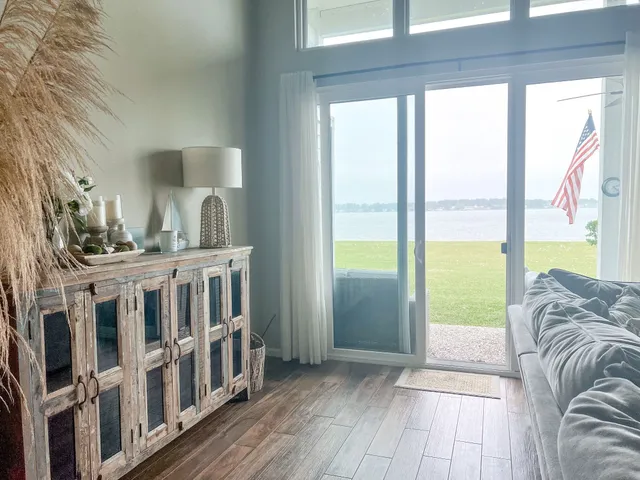 a view of a living room and a balcony