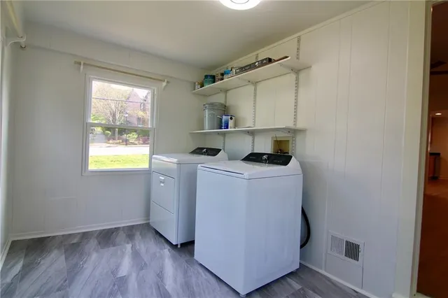 a view of storage and utility room with washer and dryer