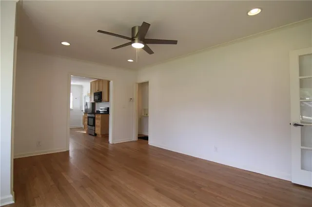 a view of wooden floor and windows in a room