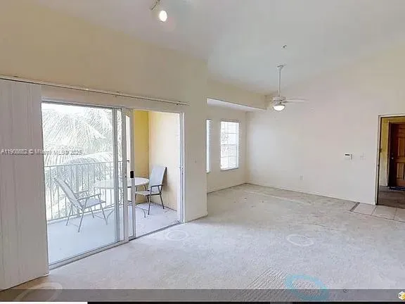 a view of a big room with closet and chandelier fan