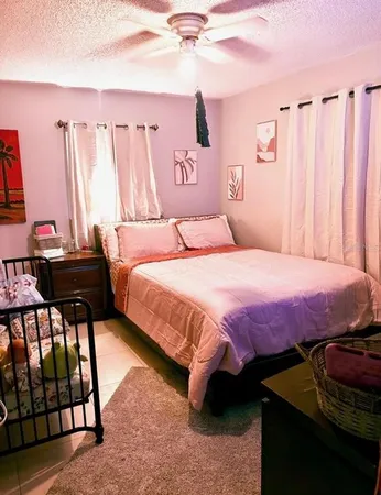 a bedroom with a bed and a table