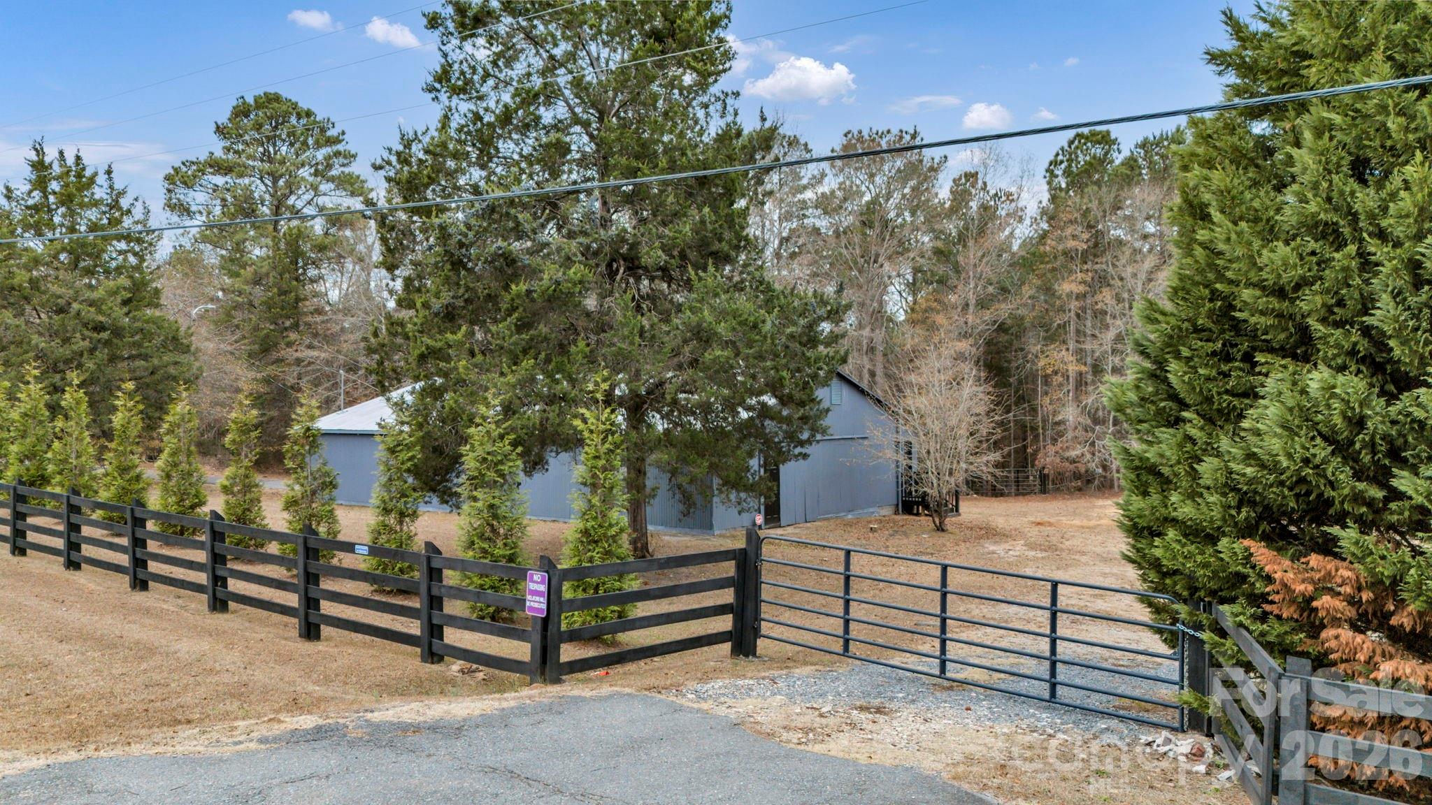 6312 Richburg Road Great Falls, SC 29055 - Photo 4 of 12 a view of a tree with wooden fence