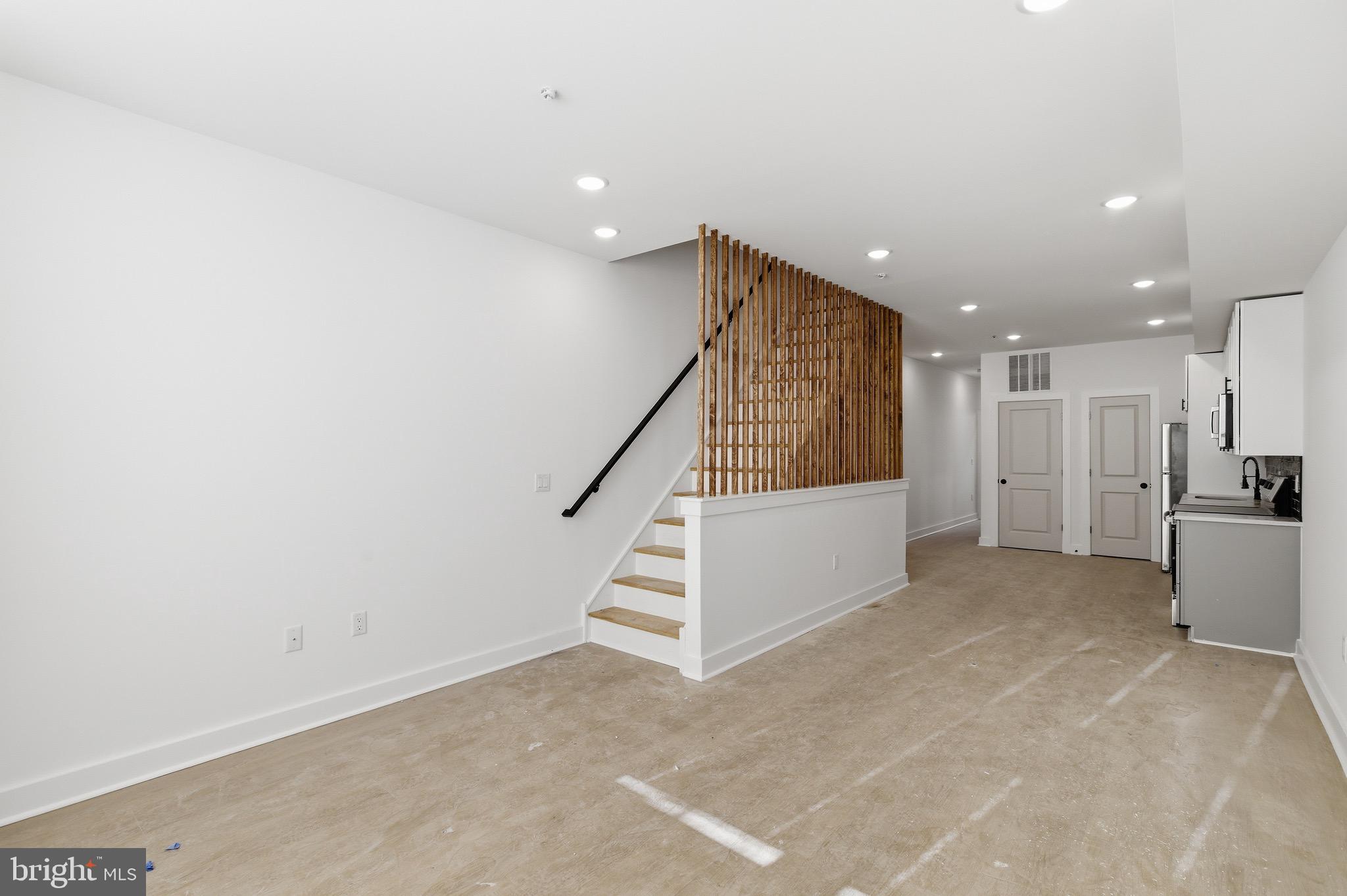 2116 North 7th Street, Unit 2 Philadelphia, PA 19122 - Photo 11 of 21 a view of an empty room with stairs