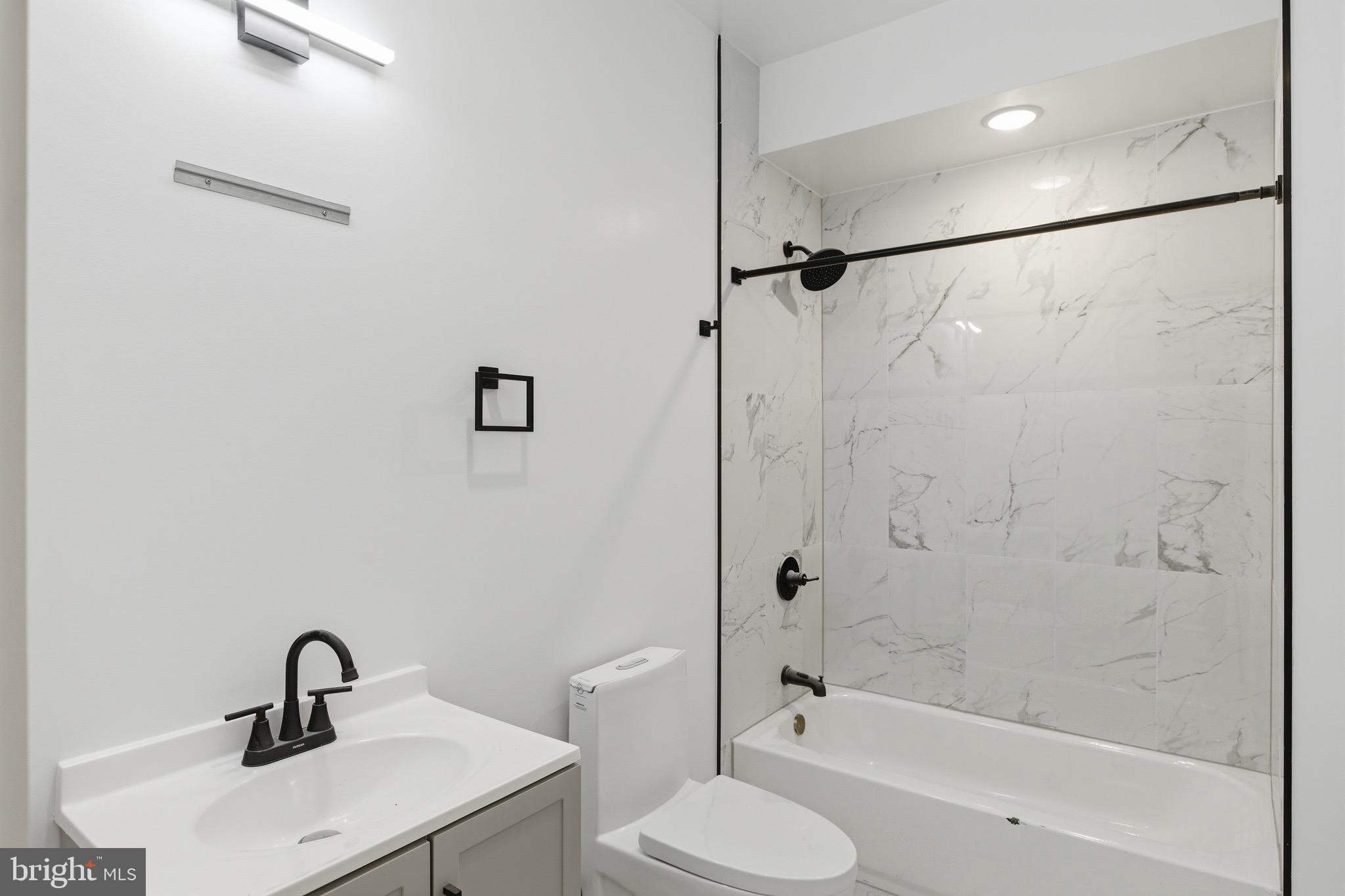 2116 North 7th Street, Unit 2 Philadelphia, PA 19122 - Photo 14 of 21 a bathroom with a sink toilet and shower