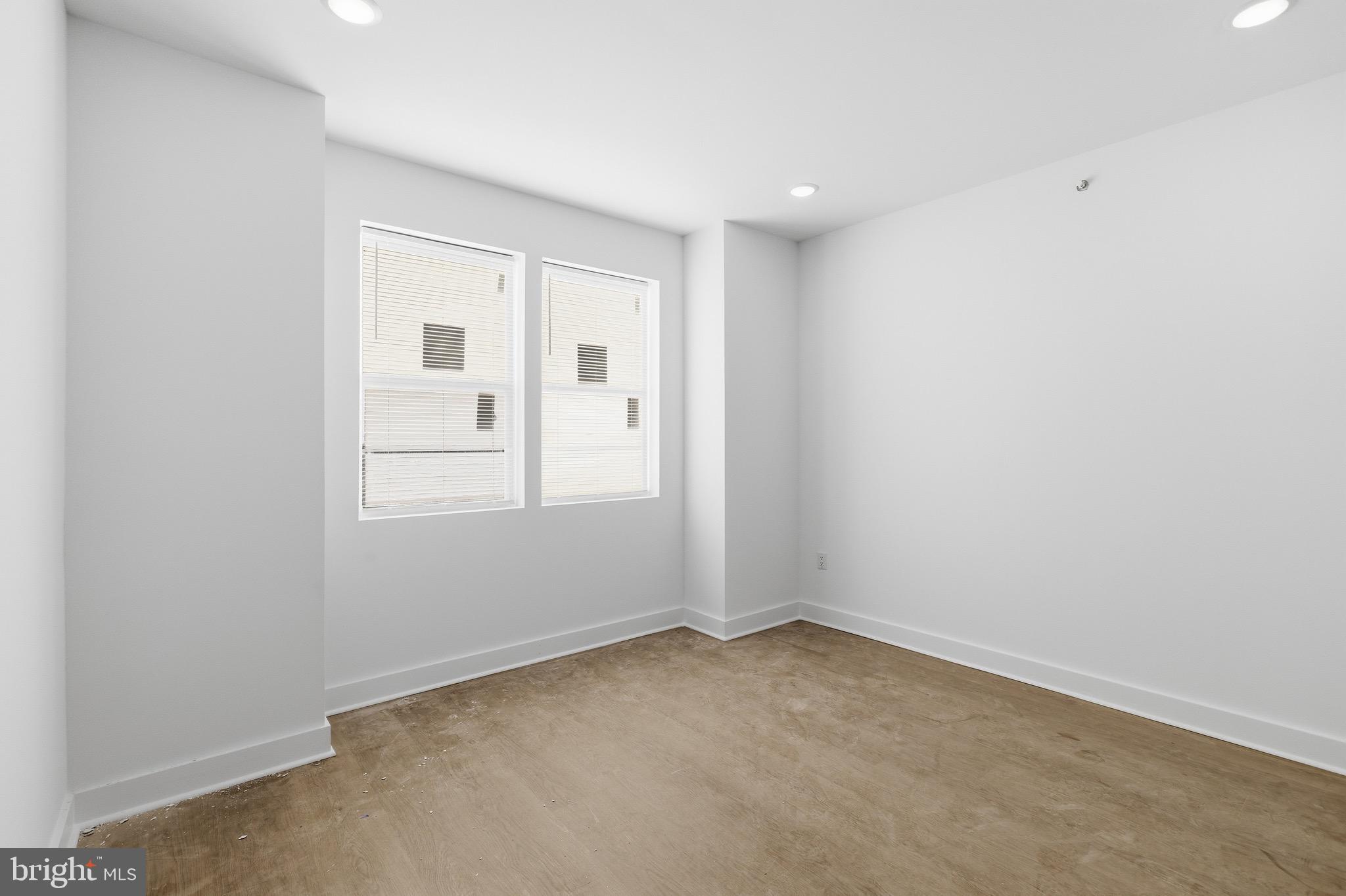 2116 North 7th Street, Unit 2 Philadelphia, PA 19122 - Photo 3 of 21 an empty room with windows and closet