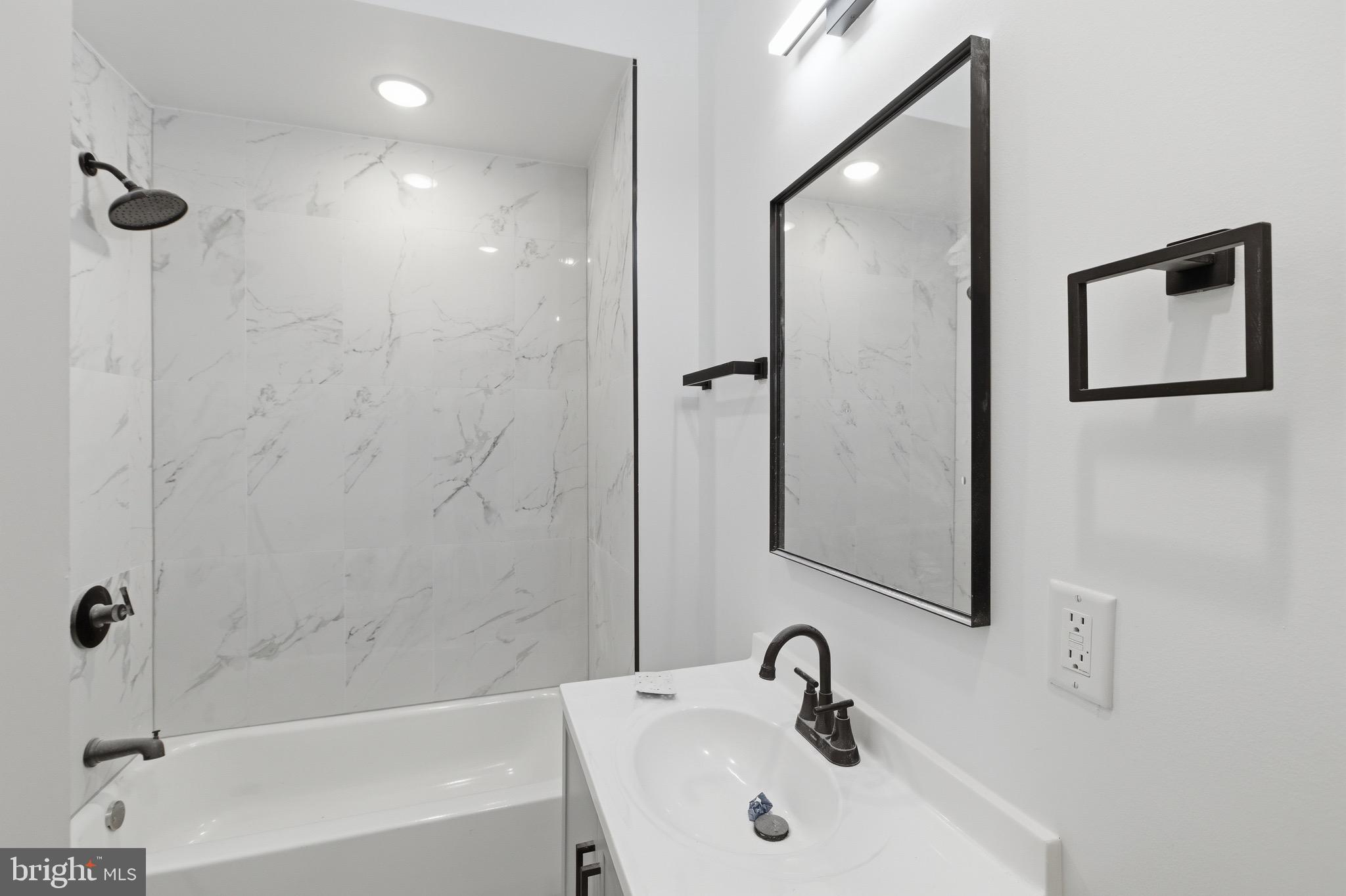 2116 North 7th Street, Unit 2 Philadelphia, PA 19122 - Photo 7 of 21 a bathroom with a sink and a mirror