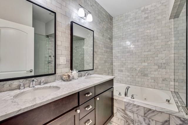 33 North Morgan Street, Unit 3 Chicago, IL 60607 - Photo 11 of 15 a bathroom with a bathtub double vanity sink and mirror