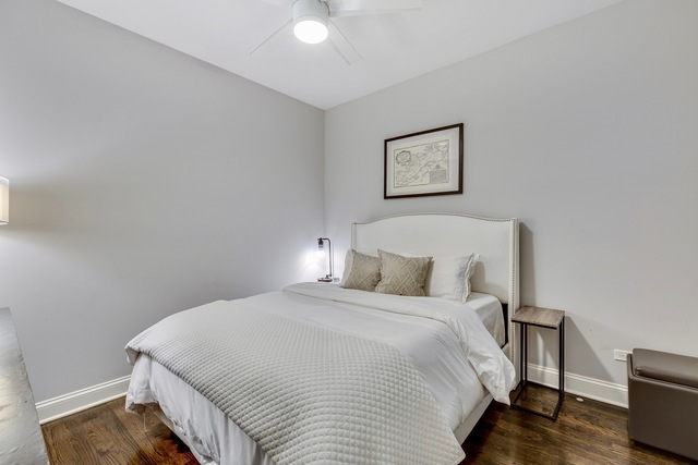 33 North Morgan Street, Unit 3 Chicago, IL 60607 - Photo 13 of 15 a bedroom with a bed and a night stand