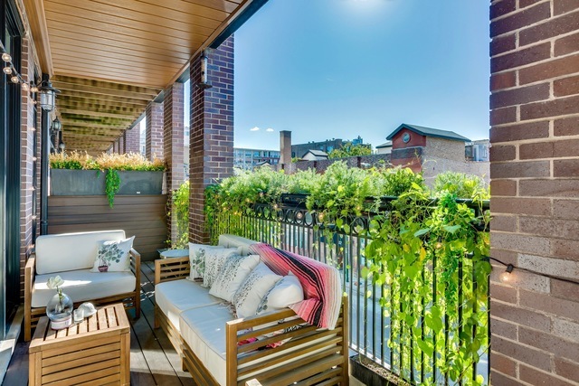 33 North Morgan Street, Unit 3 Chicago, IL 60607 - Photo 9 of 15 a view of a balcony with chairs and a potted plant