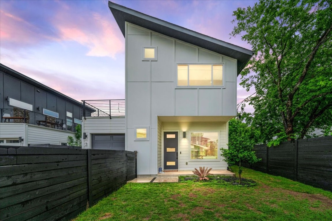 6300 Santos Street, Unit 3 Austin, TX 78741 - Photo 1 of 32 a front view of a house with a yard