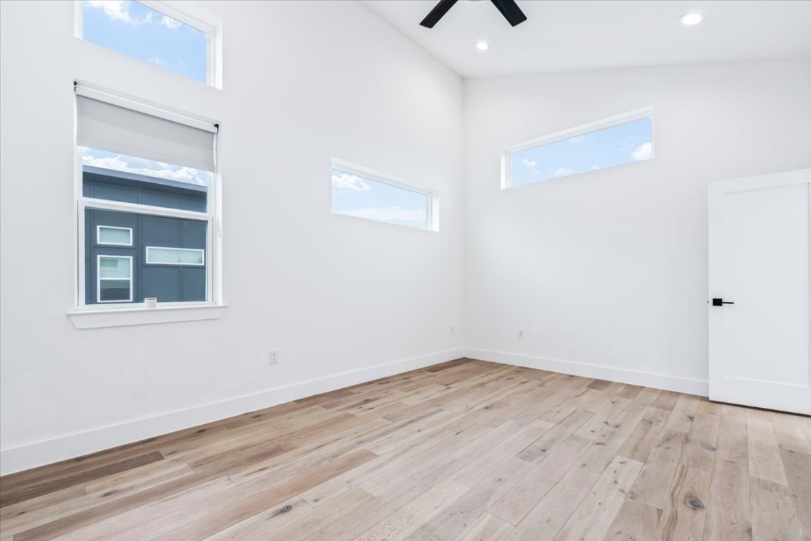 6300 Santos Street, Unit 3 Austin, TX 78741 - Photo 20 of 32 a view of an empty room with wooden floor and a window