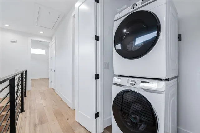 a view of a hallway with washer and dryer
