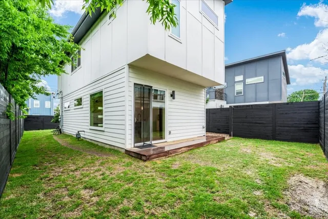 a view of a house with a yard and plants