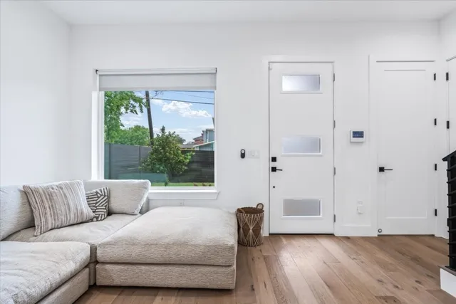 a living room with furniture and a large window