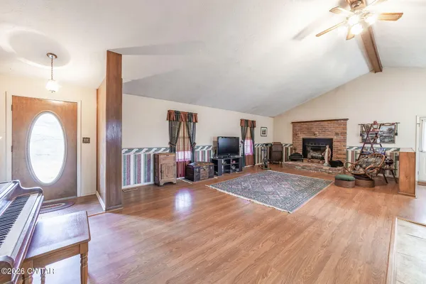 a view of a livingroom with furniture and a fireplace