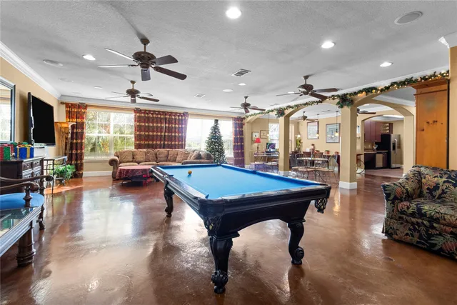 a room with lots of furniture and a large window