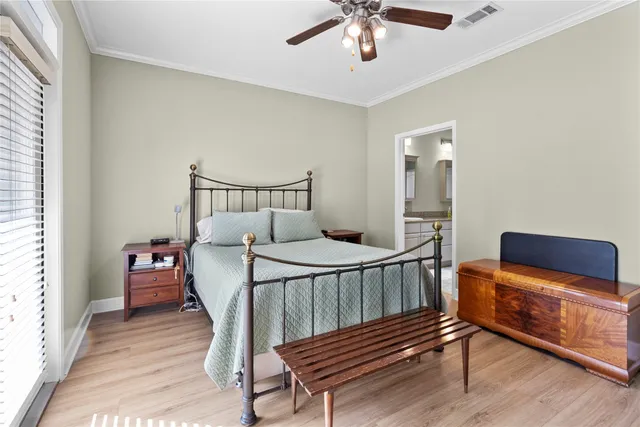 a bedroom with furniture and wooden floor