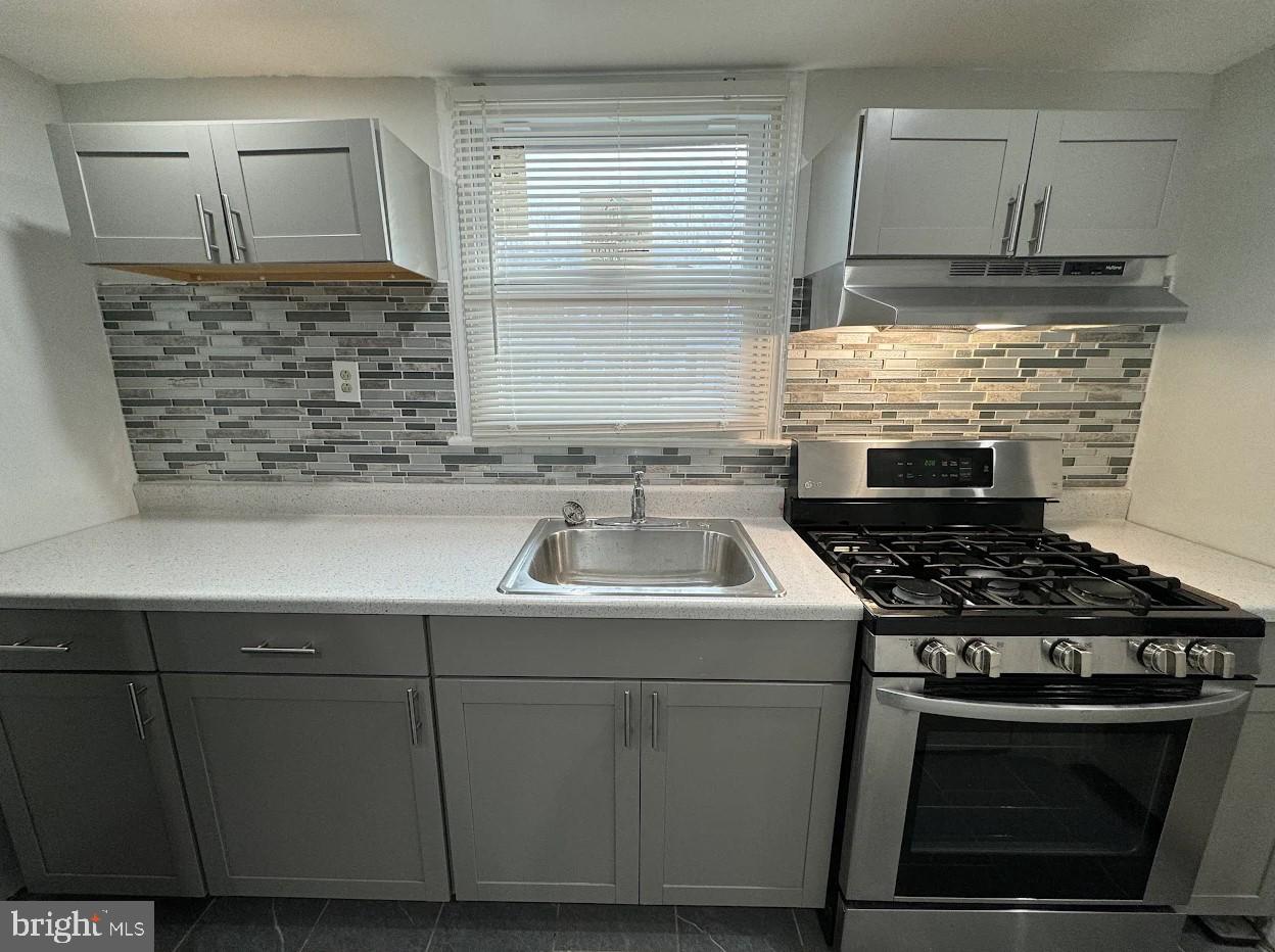 2630 McCarey Street Chester, PA 19013 - Photo 2 of 11 a kitchen with a stove and a sink