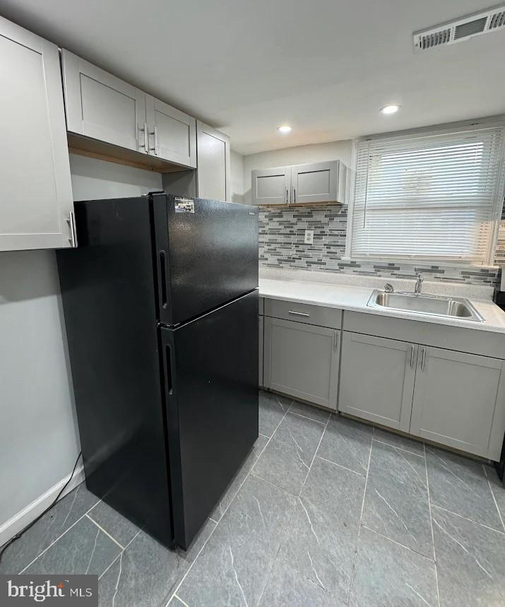 2630 McCarey Street Chester, PA 19013 - Photo 4 of 11 a kitchen with stainless steel appliances a sink and a refrigerator