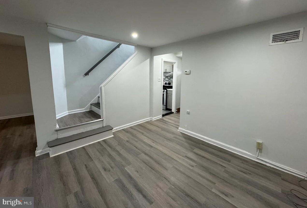 2630 McCarey Street Chester, PA 19013 - Photo 5 of 11 an empty room with wooden floor and entrance