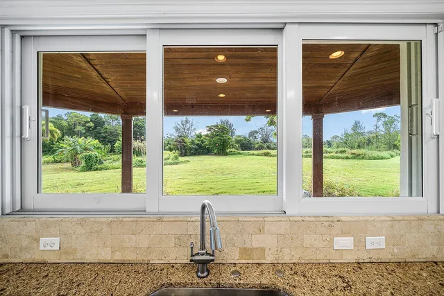 a bedroom with double bed and a window