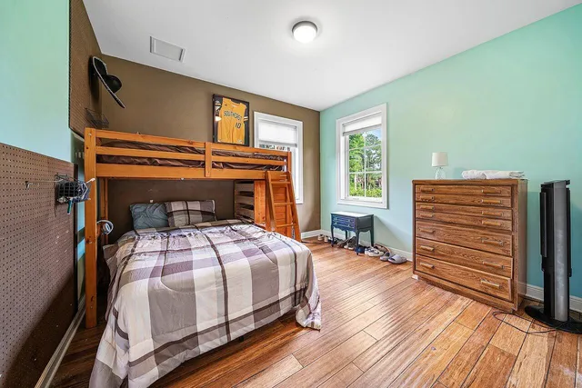 a bedroom with a bed and a dresser