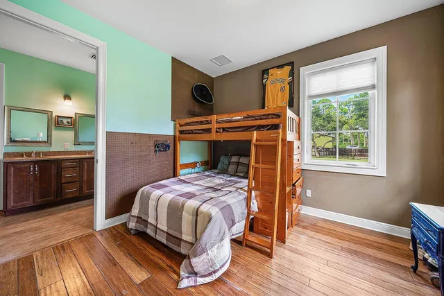 a bedroom with a bed and a television