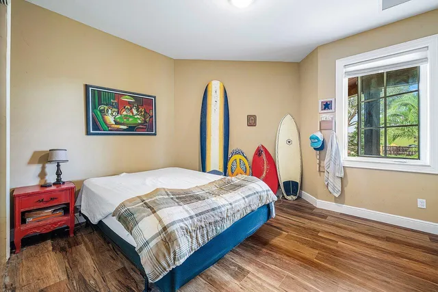 a living room with furniture and a dining table