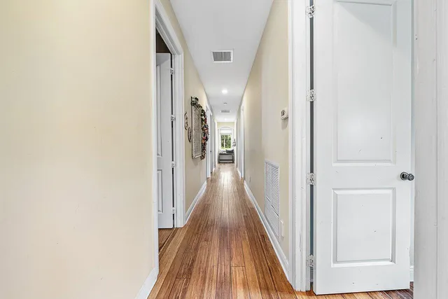 a spacious bedroom with a large bed and a large window