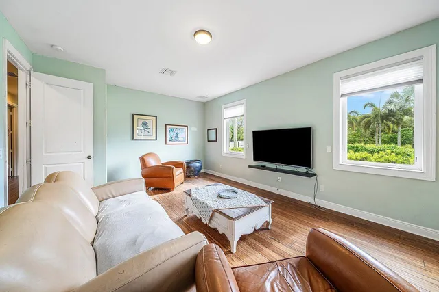 a spacious bathroom with a granite countertop tub sink and mirror
