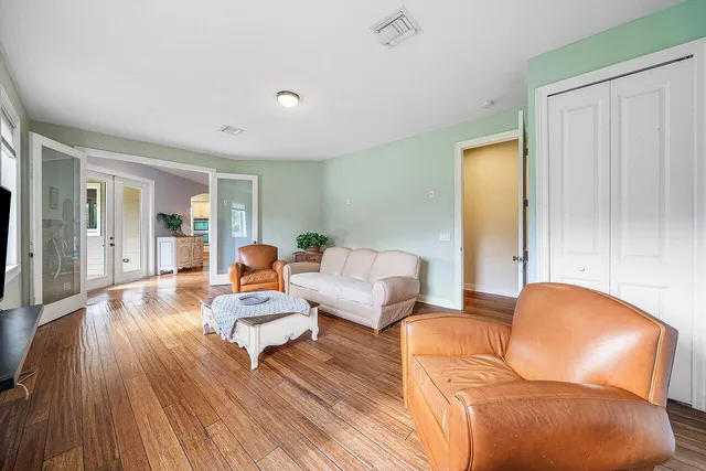 a spacious bathroom with a granite countertop sink and a bathtub