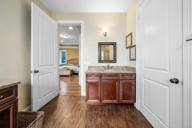 a view of a patio with table and chairs next to a yard