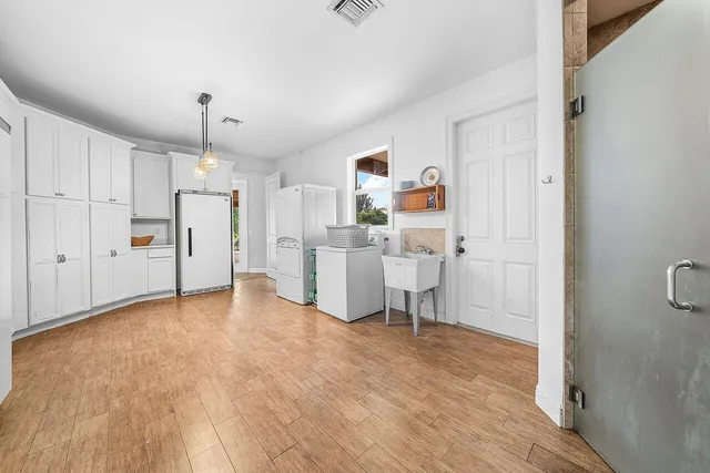 a view of a patio with a table and chairs