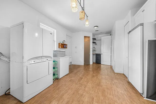 a view of a porch with a big yard and potted plants
