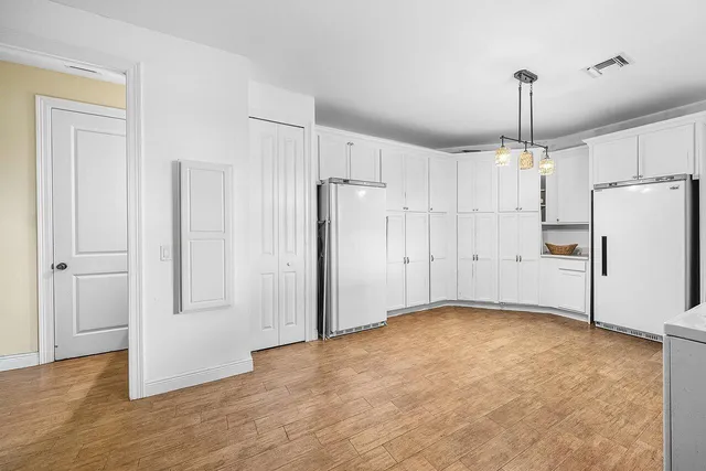 a view of field with an trees