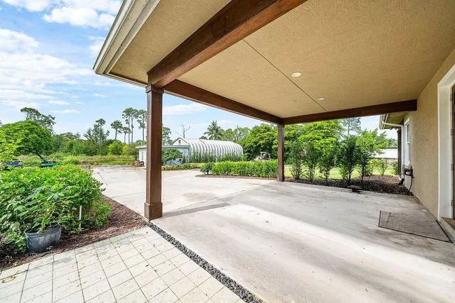 a view of a house with outdoor space and swimming pool