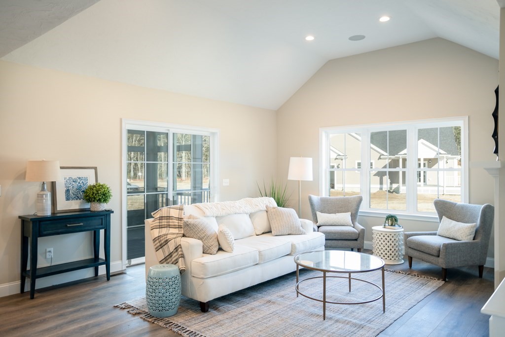 7 Hayley Circle, Unit 34 Rochester, MA 02770 - Photo 2 of 12 a living room with furniture and wooden floor