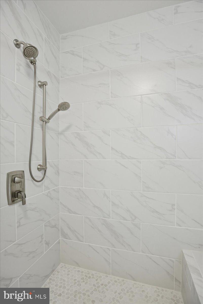 1126 Back Creek Loop, Unit 1126 Solomons, MD 20688 - Photo 34 of 47 Gorgeous wall and floor tile