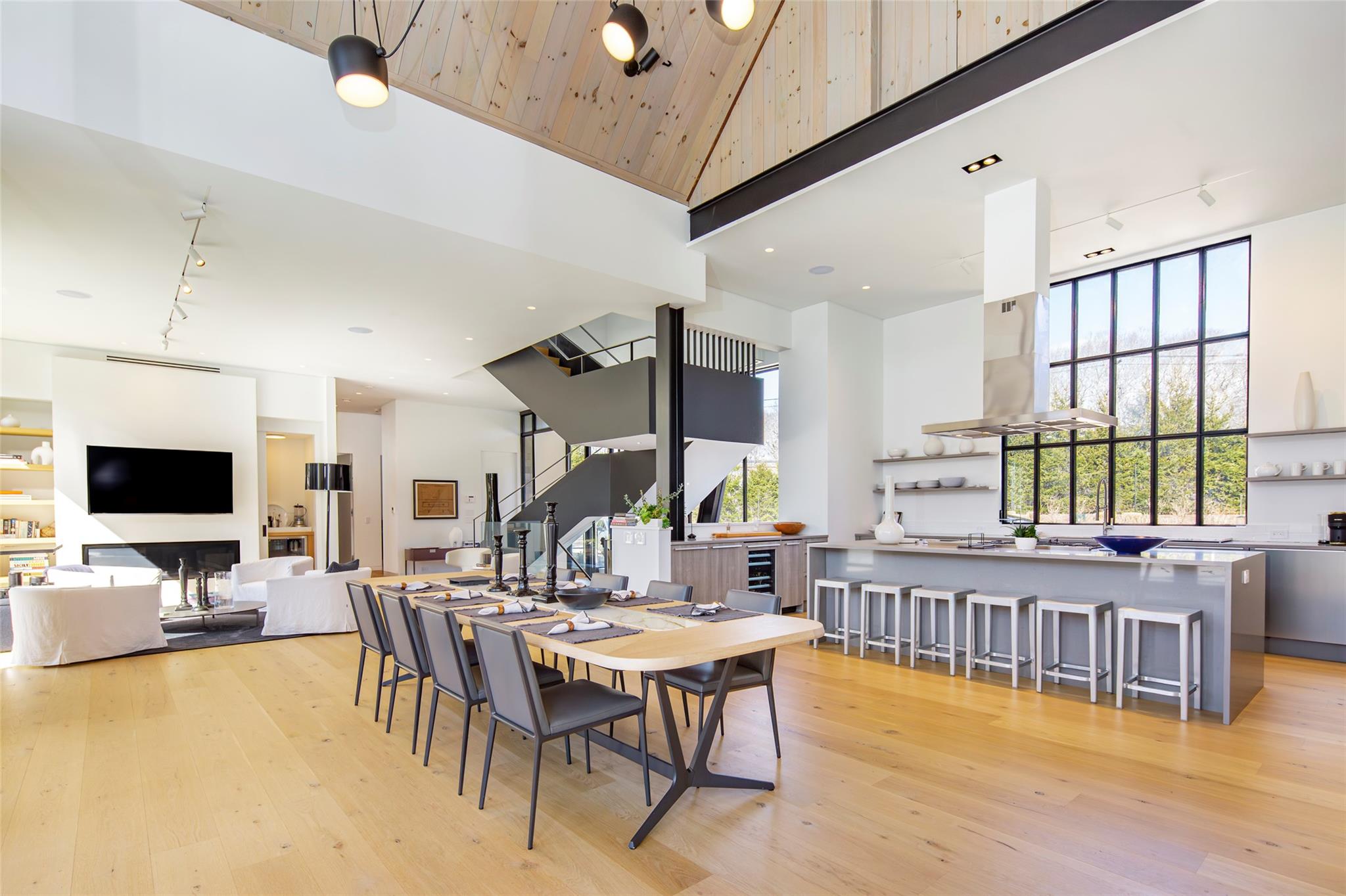 179 Montauk Highway East Hampton, NY 11937 - Photo 13 of 47 a living room with furniture and a flat screen tv